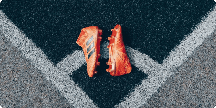 Football boots on a football pitch